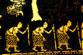 Wat Xieng Thong temple in Luang Prabang, Laos. Detail of the  intricate gold stencilling on black lacquer that decorate the walls of the sim. 